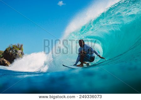 July 7, 2018. Bali, Indonesia. Surfer Ride On Big Barrel Wave At Padang Padang. Professional Surfing