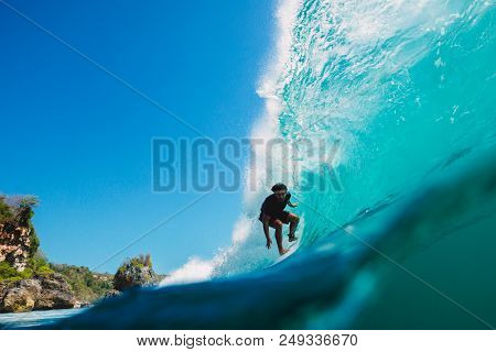 July 7, 2018. Bali, Indonesia. Surfer Ride On Big Barrel Wave At Padang Padang. Professional Surfing