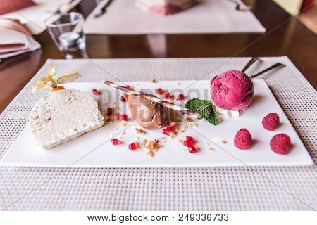 Piece Of Brown Mousse A U Chocolate Sweet Dessert And Decoration On A White Plate Background