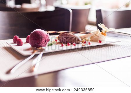 Piece Of Brown Mousse A U Chocolate Sweet Dessert And Decoration On A White Plate Background