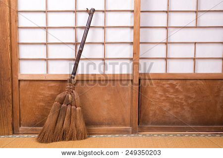 Broom Made From Chusan Palm Which Lean On Paper Sliding Door