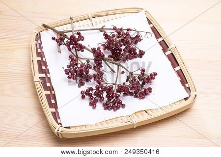 Dark Red Linden Viburnum Fruit On Bamboo Sieve