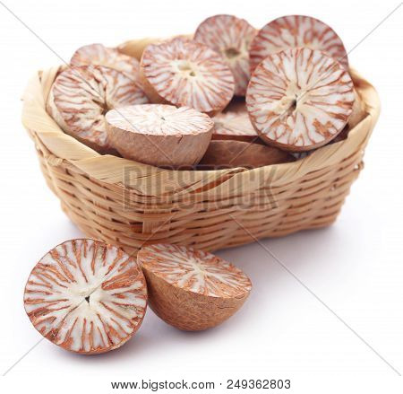 Betel Nuts In A Basket Over White Background