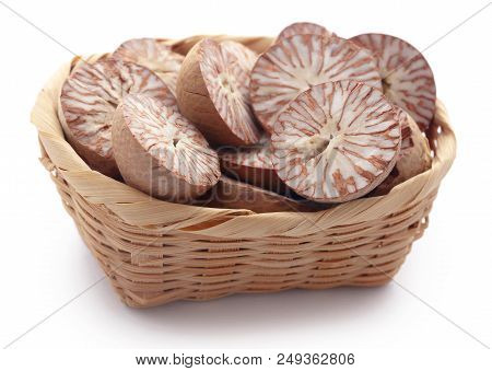 Betel Nuts In A Basket Over White Background