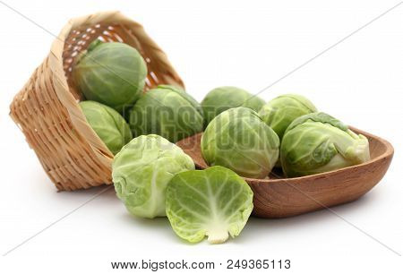 Rosenkohl Or Brussels Sprouts In A Basket Isolated Over White Background