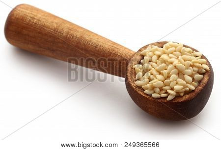 Peeled Sesame Seeds In A Spoon Over White Background