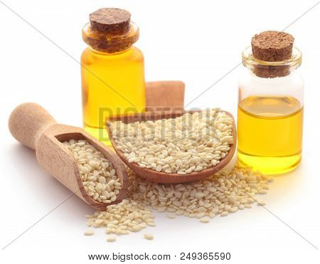 Peeled Sesame Seeds With Oil Over White Background