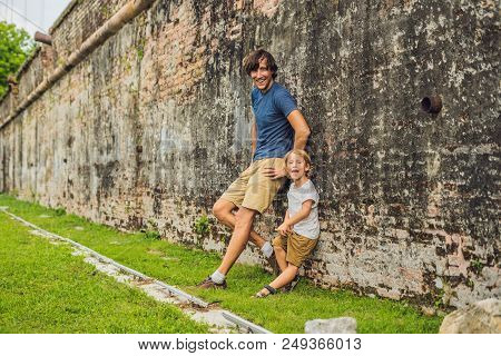 Dad And Son On Background Of Fort Cornwallis In Georgetown, Penang, Is A Star Fort Built By The Brit