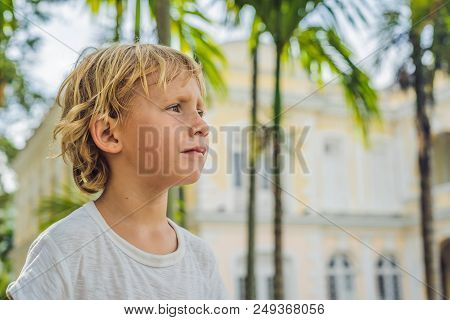 Boy On Background Of Old Town Hall In George Town In Penang, Malaysia. The Foundation Stone Was Laid