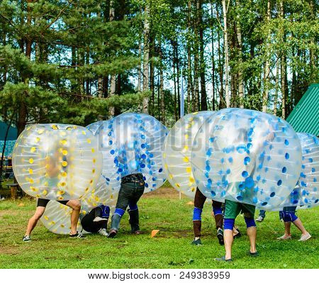 People Play Bumperball Outdoor, Zorbsoccer, Entertainment For Young People