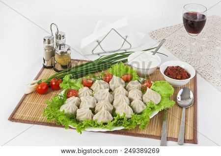 Kinkali In Green With Tomatoes And Onions. Serve With Soy Sauce And Sour Cream.
