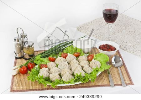Kinkali In Green With Tomatoes And Onions. Serve With Soy Sauce And Sour Cream.