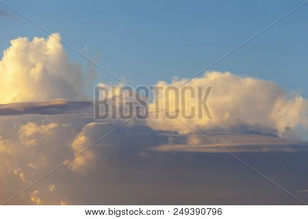 Heapy Clouds With Warm Sunset's Ray.