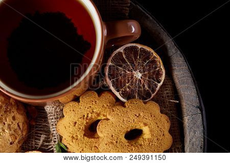 Cookies With Cinnamon And Two Cups Of Tea On A Burlap Napkin, Selective Focus, Close-up, Top View. D