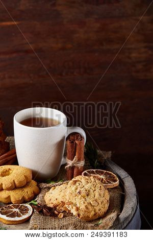 Cookies With Cinnamon And Two Cups Of Tea On A Burlap Napkin, Selective Focus, Close-up, Top View. D