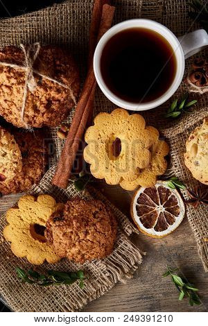 Cookies With Cinnamon And Two Cups Of Tea On A Burlap Napkin, Selective Focus, Close-up, Top View. D