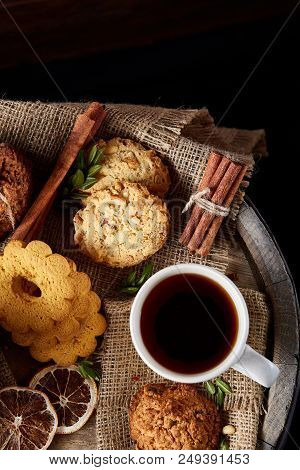 Cookies With Cinnamon And Two Cups Of Tea On A Burlap Napkin, Selective Focus, Close-up, Top View. D