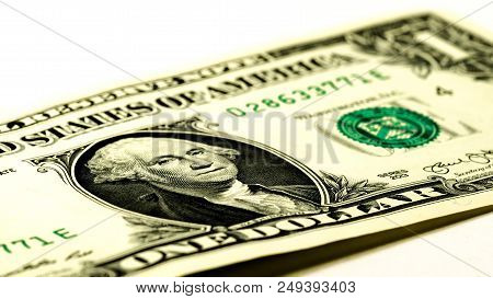 Dollar Bills Over A White Background. Symbol Of Wealth