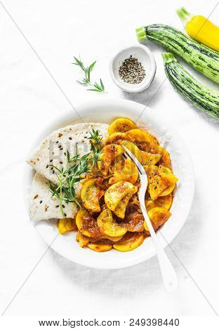 Zucchini Squash Curry Sauce And Whole Grain Flatbread On A Light Background, Top View. Indian Vegeta