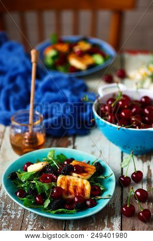 Grilled Halumi  Cheese Salad With Berries.food Gathering.selective Focus