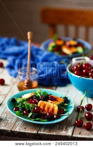 Grilled Halumi  Cheese Salad With Berries.food Gathering.selective Focus