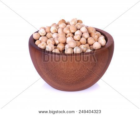 Dried Chickpeas In Wooden Bowl On White Background.