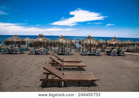 Permissa black sand beach in Santorini. Greece. 