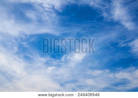 Beautiful Blue Sky With Fleecy Clouds. Abstract Background.