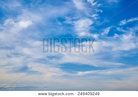 Beautiful Blue Sky With Fleecy Clouds. Abstract Background.