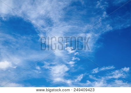 Beautiful Blue Sky With Fleecy Clouds. Abstract Background.