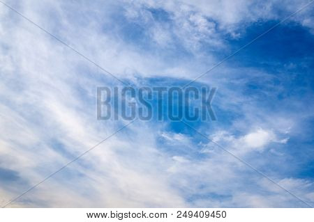 Beautiful Blue Sky With Fleecy Clouds. Abstract Background.