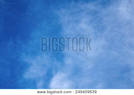 Beautiful Blue Sky With Fleecy Clouds. Abstract Background.