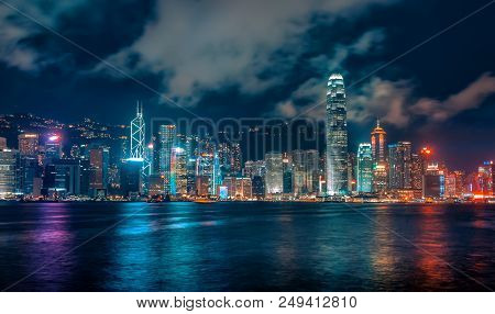 Futuristic City Skyline at Night with Colourful Lights and Reflections, Hong Kong