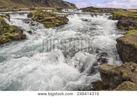 Rapids And Small Waterfalls On The Fossálar River In Southern Iceland.