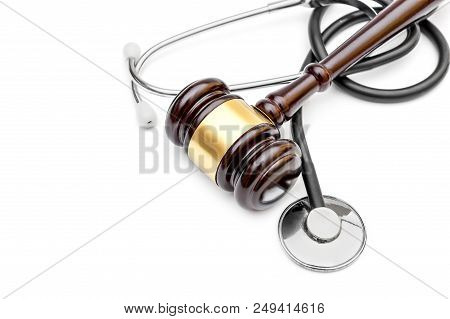 Gavel With Stethoscope On White. Top View. Copy Space. Medical Law.