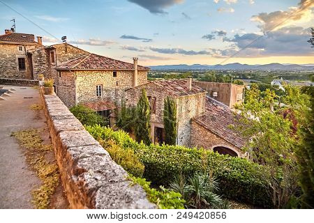 Tiled Roofs Of Houses And Sky With Clouds On The Background Of Mountains. Beautiful Scenic View Of B