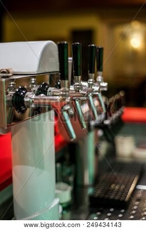 Close Up Draft Beer And Lemonade Dispensing Tower Of A Bar Restaurant