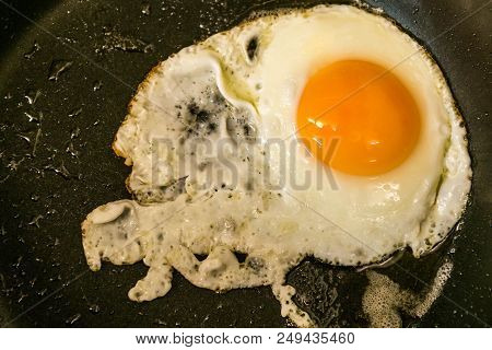 Traditional Easy Breakfast Meal Fried Eggs Served On A Frying Pan.