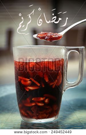 A Spoon Above A Jallab Tall Glass. Jallab Is A Refreshing Summer Drink, Popular During Ramadan. Arab