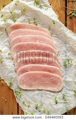 Butchers Made Free Range Raw Lean Unsmoked Bacon Pork Medallions And Hen Eggs On Wooden Box.