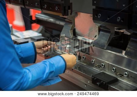 Worker Working In Factory In Metal Sheet Bending Process, This Immage Can Use For Factory, Industria