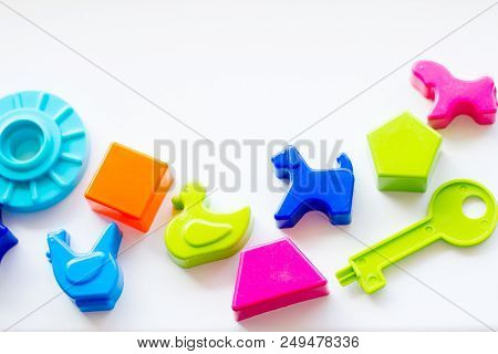Set Of Toys For Babies On A White Table