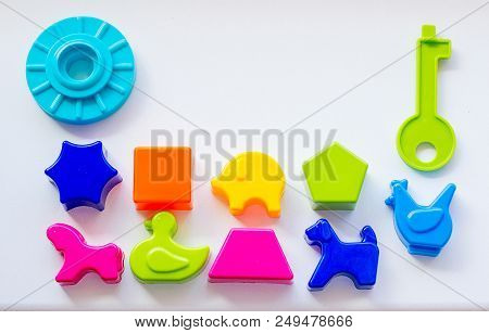 Set Of Toys For Babies On A White Table