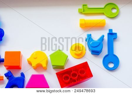 Set Of Toys For Babies On A White Table