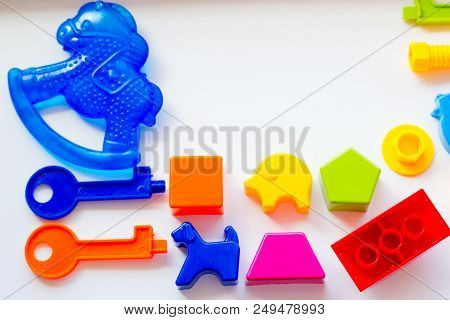 Set Of Toys For Babies On A White Table