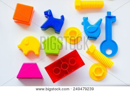 Set Of Toys For Babies On A White Table