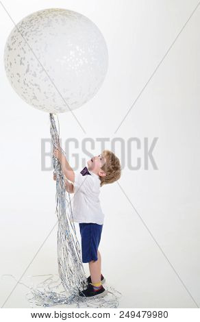 Boy In White Shirt Holds Big Balloon. Big White Balloon. Celebration Concept. Party Mood. Copy Space