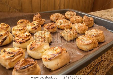 Freshly Baked Homemade Cinnamon Rolls Lie On A Baking Sheet.