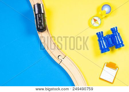 Kids Toys Summer Vacation Background With Train, Binoculars, Compass And Note
