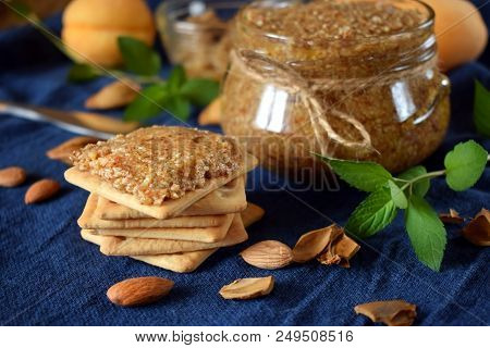 Urbech Of Apricot Kernels In A Glass Jar And On A Cracker